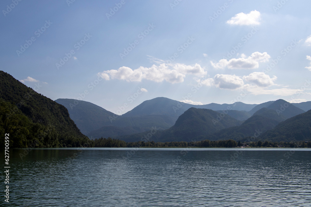 Mountain background with blue sky and clouds. Mountain lake. Mountain background with blue sky and clouds. Mountain lake.
