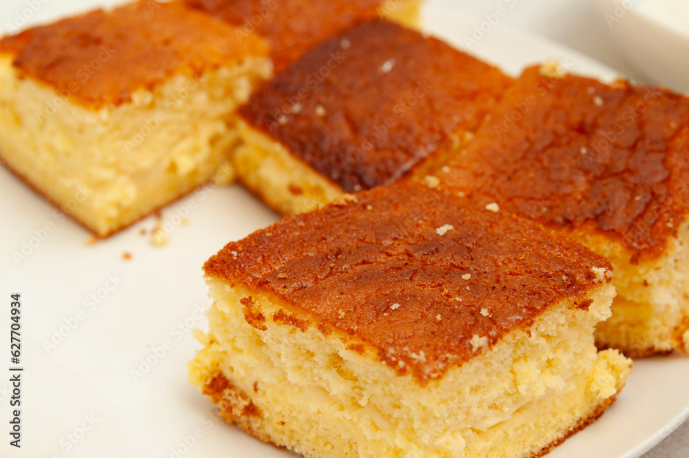 Delicious and Traditional Brazilian dessert known as BOLO GELADO - Making step by step: Close-up of cake pieces Delicious and Traditional Brazilian dessert known as BOLO GELADO - Making step by step: Close-up of cake pieces