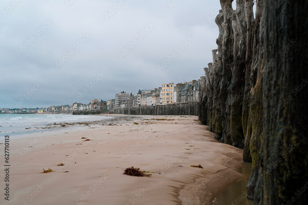 Scenic view of the Atlantic beach in Saint Malo, France, with the city in the background.