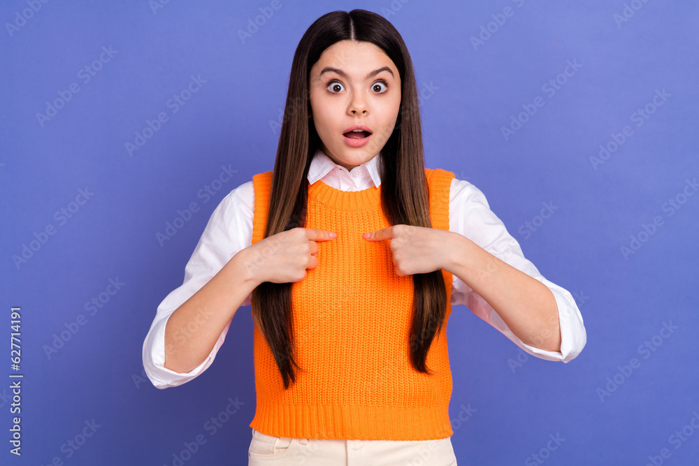 Photo of crazy young girl wear orange vest formal clothes directing fingers herself unexpected victory isolated on purple color background Photo of crazy young girl wear orange vest formal clothes directing fingers herself unexpected victory isolated on purple color background