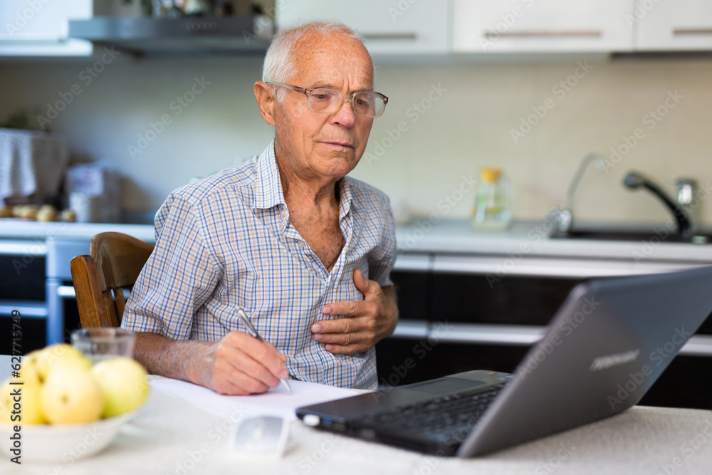 Senior man having online medical conversation Senior man having online medical conversation
