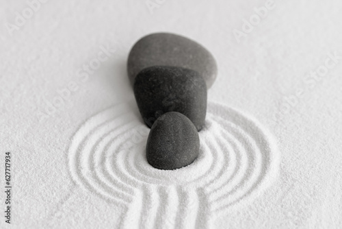 Photography Zen Garden with Grey Stone on White Sand Line Texture Background, Black Rock Sea Stone on Sand Wave Parallel Lines Pattern in Japanese stye, Simplicity Day, Meditation,Zen like concept