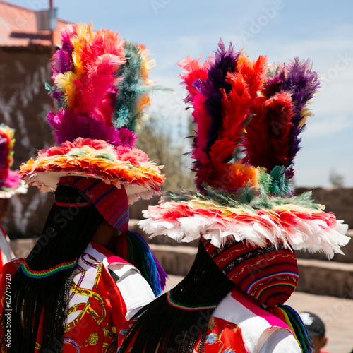 Locals from the island of Taquile in Peru dancing at an event in the main square of the island. photo