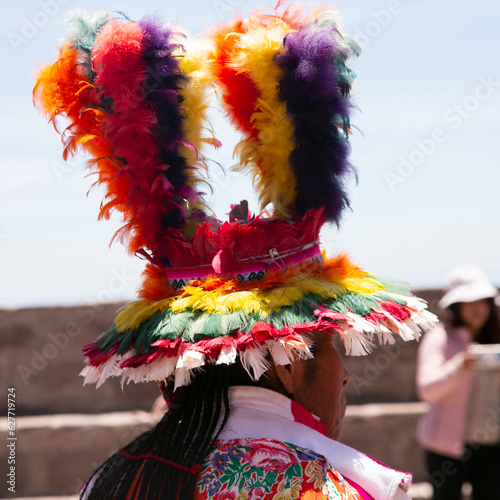 Locals from the island of Taquile in Peru dancing at an event in the main square of the island.