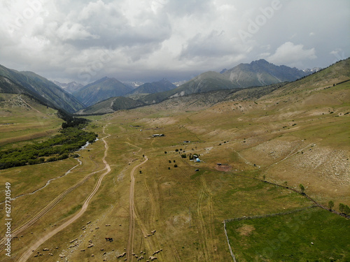 Semenovskoye Grigorevskoye Canyon mountains and green valley Kyrgystan near Issyk Kul. Aerial drone view. Flying over. High quality photo photo