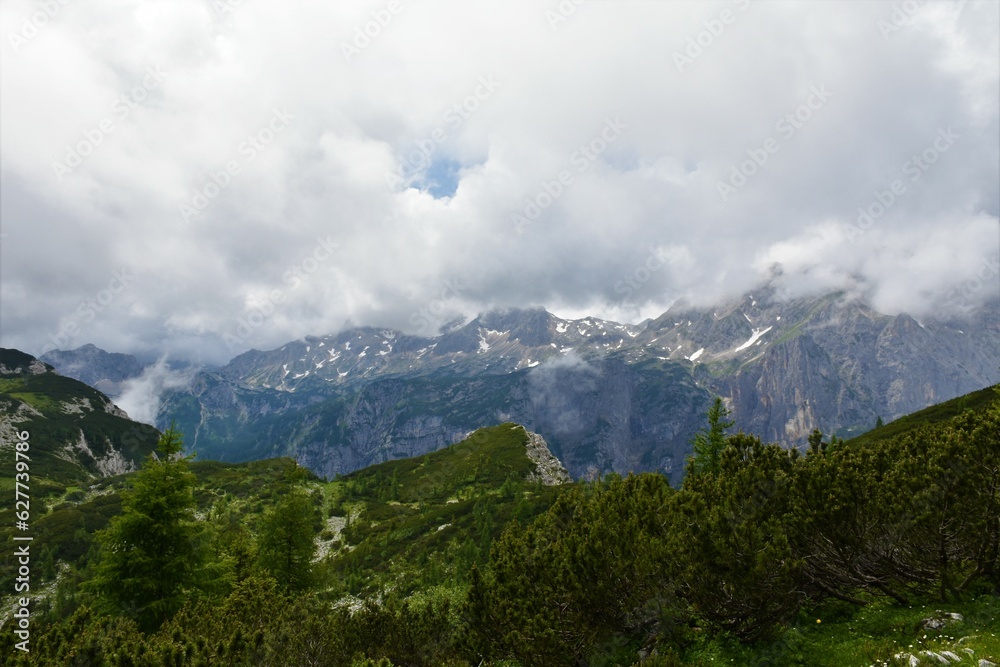 Triglav mountain in clouds and Krma valley in Julian alps, Gorenjska, Slovenia