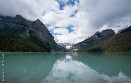 Beautiful glacial mountain lake with snow capped mountains 4