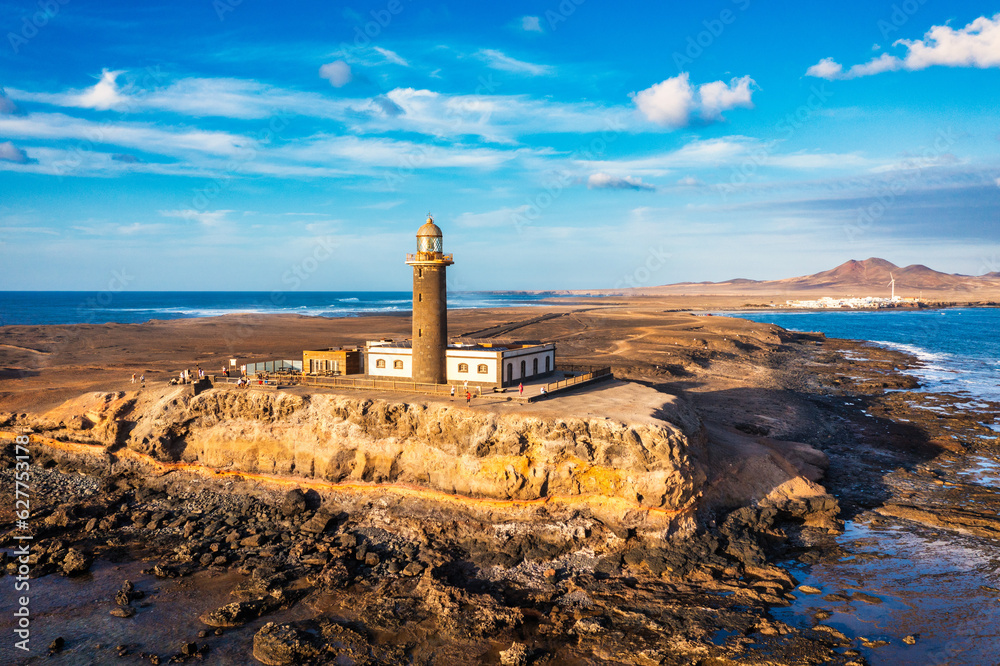 Obraz premium Punta de Jandia lighthouse from above, aerial blue sea, Fuerteventura, Canary Island, Spain. Punta Jandia lighthouse (Faro de Punta Jandia). Fuerteventura, Canary Island, Spain.