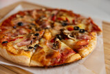 pizza with bacon olives and mushrooms