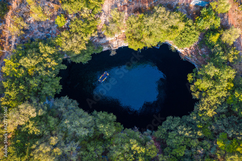 Melissani lake on Kefalonia island, Greece. Melissani Cave (Melissani Lake) near Sami village in Kefalonia island, Greece. Tourist boat on the lake in Melissani Cave, Kefalonia Island, Greece