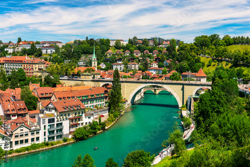 View of the Bern old city center and Nydeggbrucke bridge over river Aare  Bern  Switzerland. Bern old town with the Aare river flowing around the town on a sunny day  Bern  Switzerland.