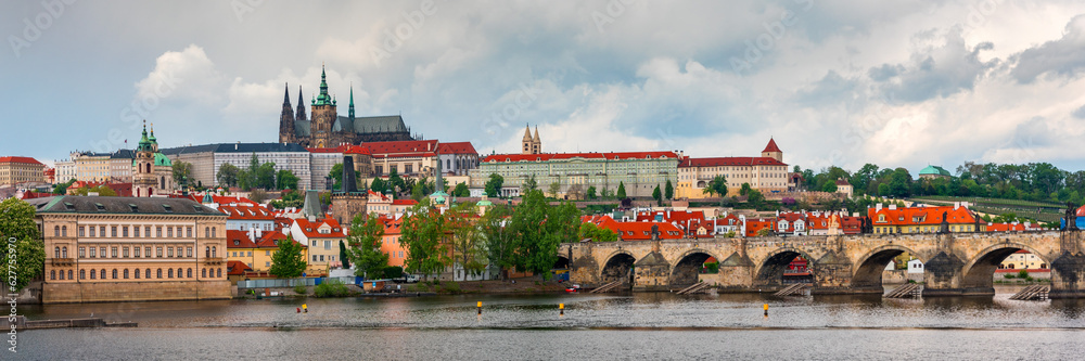 Obraz premium Prague scenic spring view of the Prague Old Town pier architecture Charles Bridge over Vltava river in Prague, Czechia. Old Town of Prague with the Castle in the background, Czech Republic.