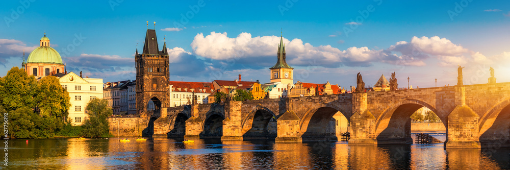 Old town of Prague. Czech Republic over river Vltava with Charles Bridge on skyline. Prague panorama landscape view with red roofs.  Prague view from Petrin Hill, Prague, Czechia.