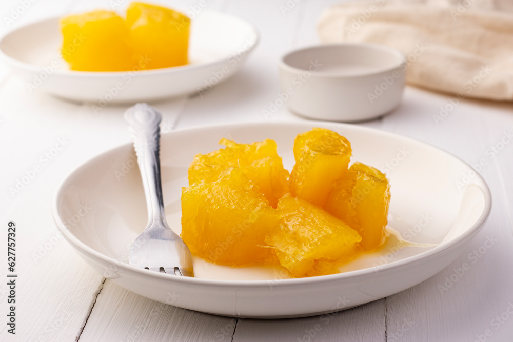 Sweet Cassava or Tapioca in heavy Syrup topped with coconut milk on a plate,sweetened thai snack food Sweet Cassava or Tapioca in heavy Syrup topped with coconut milk on a plate,sweetened thai snack food
