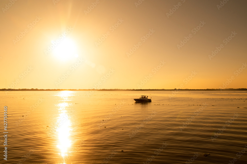 sunset on the lake Guaiba located in Porto Alegre, Rio Grande do Sul, Brazil