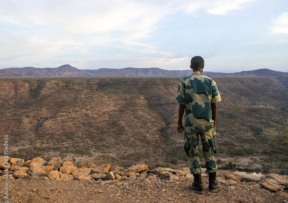 Ethiopian soldier looking the valley, Afar region, Awash, Ethiopia Ethiopian soldier looking the valley, Afar region, Awash, Ethiopia
