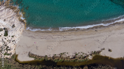 Aerial top view of Livadi Beach at the Ikaria island in a quiet summer day with blue clear water photo