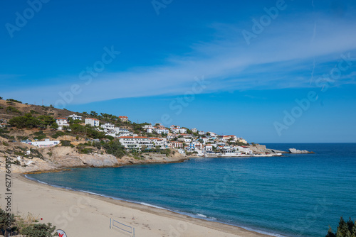 Fototapeta Naklejka Na Ścianę i Meble -  lovely greek fisher town of Armenistis in a quiet summer morning. Port with local beach in transparent clear water at Ikaria, Greece