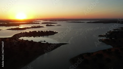 Alentejo lake in Portugal in the province of Alqueva boarder the municipalities of Portel, Moura, Reguengos de Monsaraz, Mourão and Alandroal - The largest artificial lake in Europe photo