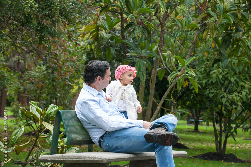 Young father having fun outdoors with his baby girl. Fatherhood concept. Happiness concept. Family concept Young father having fun outdoors with his baby girl. Fatherhood concept. Happiness concept. Family concept