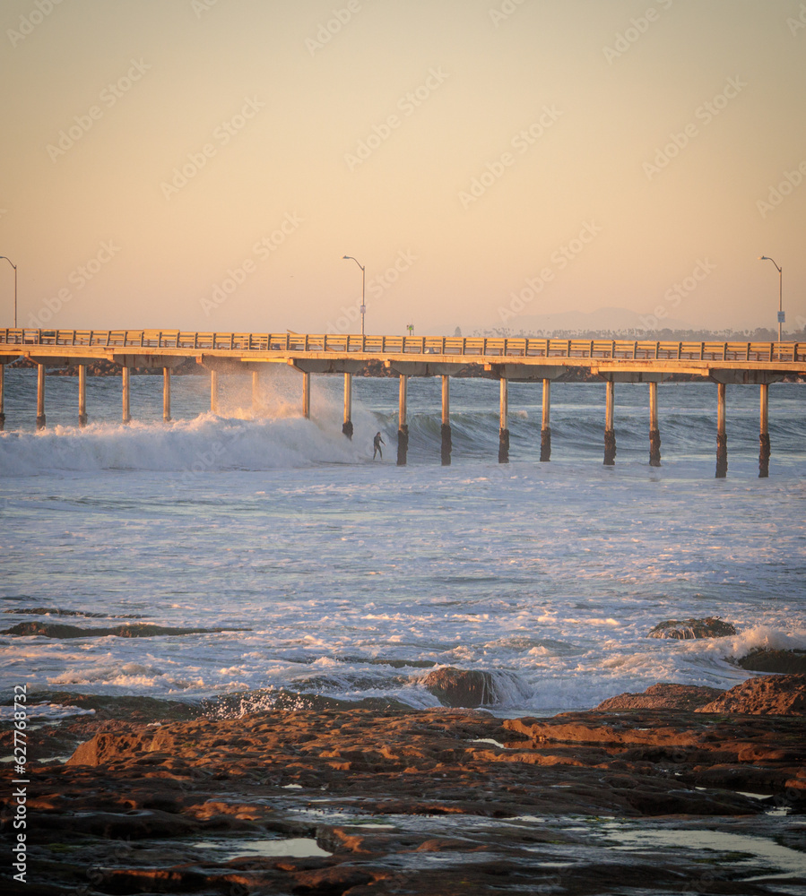 Waves crashing through pier in San Diego