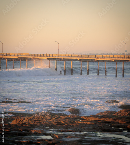 Waves crashing through pier in San Diego