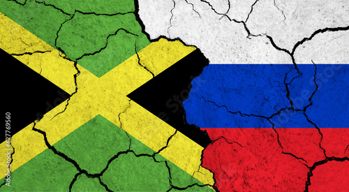 Flags of Jamaica and Russia on cracked surface - politics, relationship concept