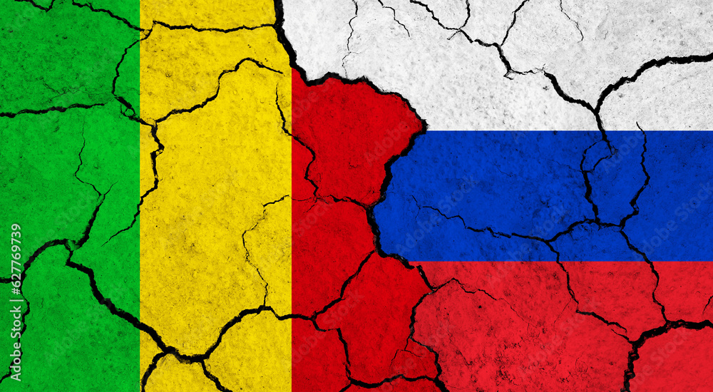 Flags of Mali and Russia on cracked surface - politics, relationship concept Flags of Mali and Russia on cracked surface - politics, relationship concept