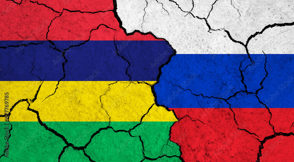 Flags of Mauritius and Russia on cracked surface - politics, relationship concept
