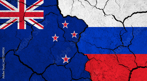 Flags of New Zealand and Russia on cracked surface - politics, relationship concept