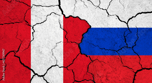 Flags of Peru and Russia on cracked surface - politics, relationship concept