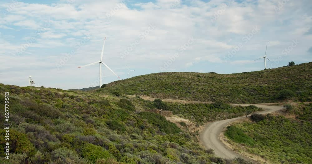 Landscape with Wind turbine spinning, static shot Landscape with Wind turbine spinning, static shot