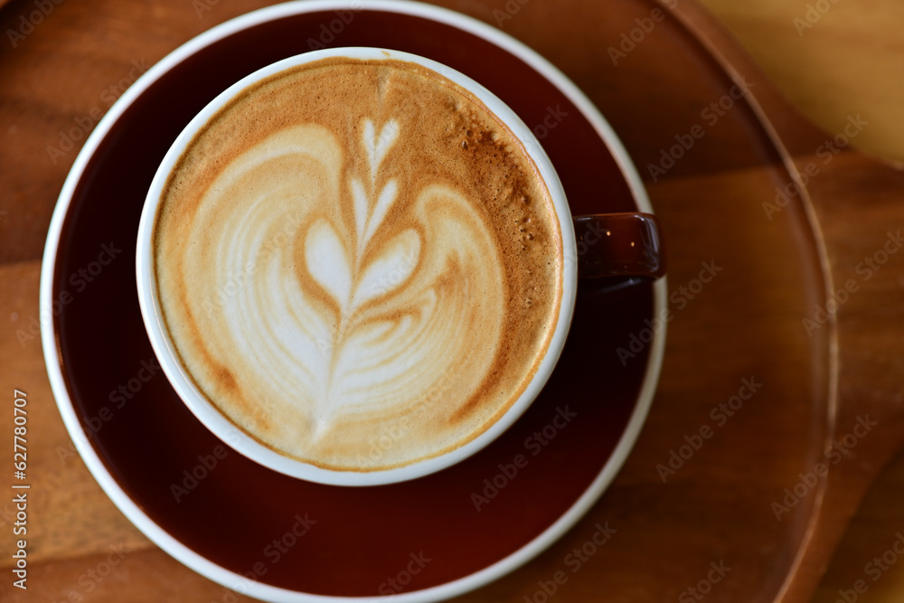 high angle view of coffee cup on wood grain table Drinking Concept: Hot Coffee, Latte, Espresso, Cappuccino high angle view of coffee cup on wood grain table Drinking Concept: Hot Coffee, Latte, Espresso, Cappuccino