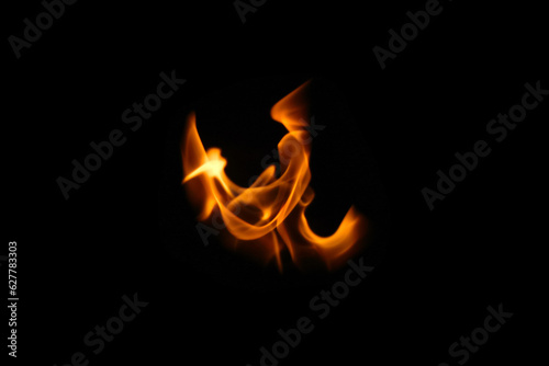 One wing in flame. Wings in Flame and Fire. Black background. Copy space. Out of focus