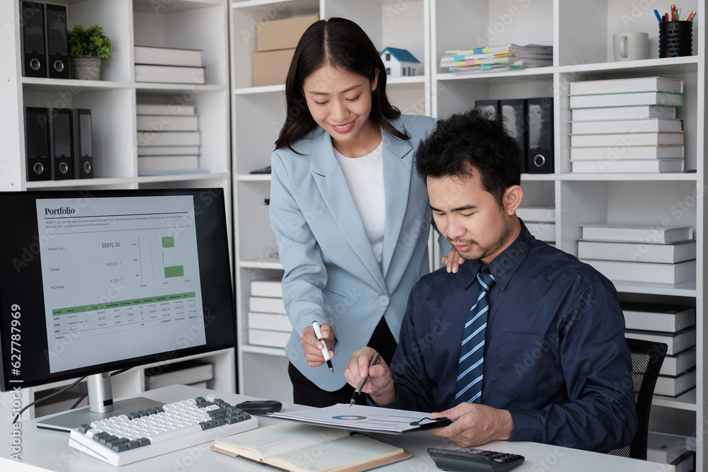 Young professional business team working and analyzing the project together, using desktop monitor in the office room. Young professional business team working and analyzing the project together, using desktop monitor in the office room.