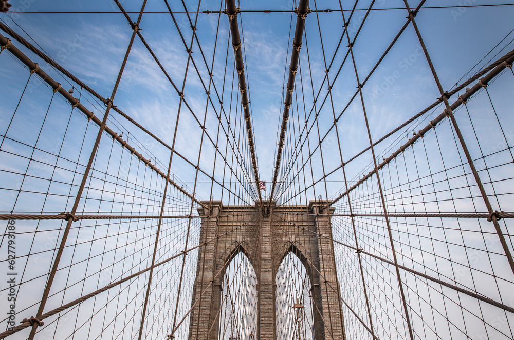 Fototapeta premium Iconic Brooklyn Bridge architectural close up with steel wires.