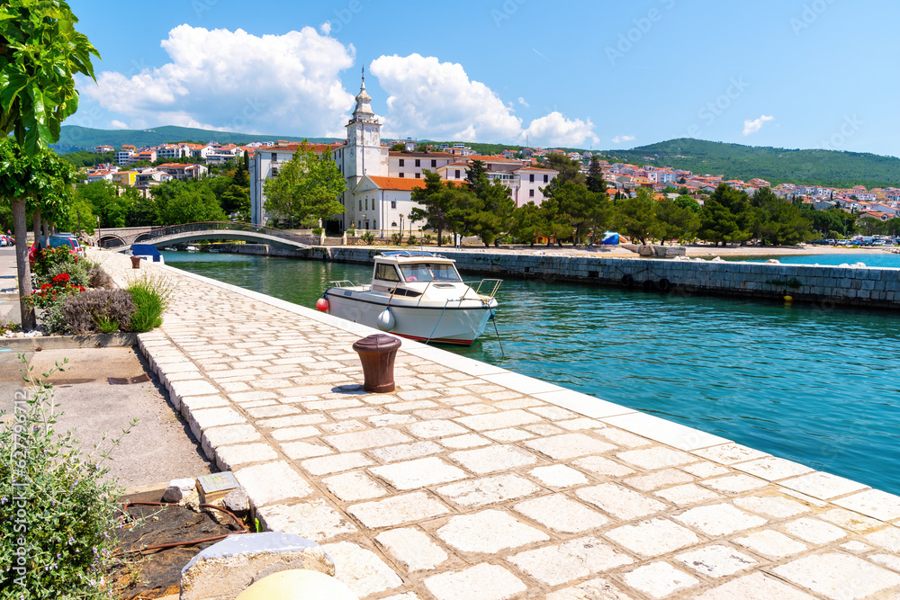 Scenic promenade with ships and restaurants in Crikvenica, Croatia