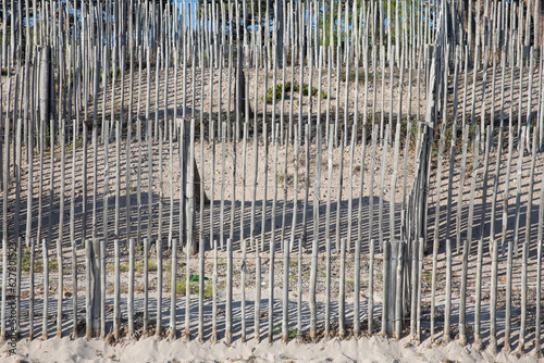 Sand fence to avoid erosion in Calvi Corsica at the mediterranean sea