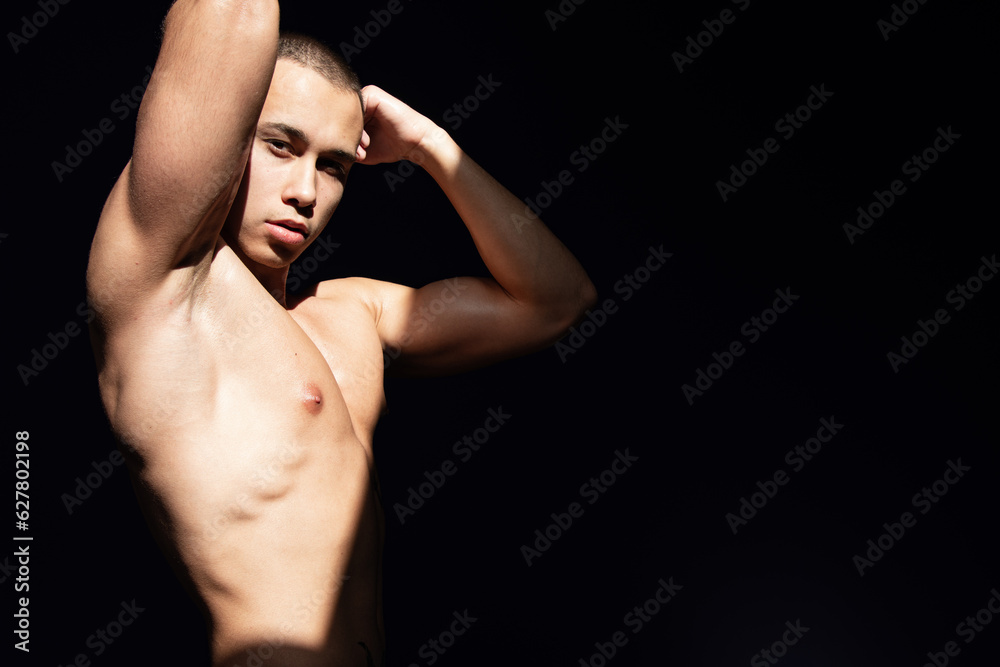 Young attractive guy is resting and posing at home.