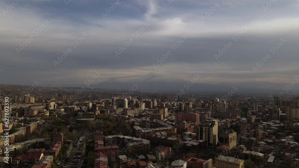 Drone flight through the city of Yerevan in Armenia with a view of Mount Ararat. Cinematic 4k footage. Drone flight through the city of Yerevan in Armenia with a view of Mount Ararat. Cinematic 4k footage.