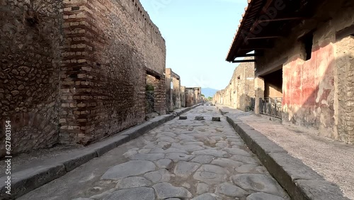 Famous ancient city of Pompeii (Scavi di Pompei) near Naples. Footpath road and ruins in ancient Pompeii, Campania, Italy