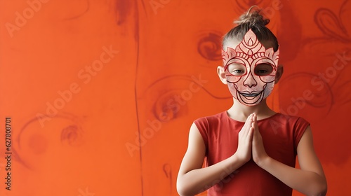 girl in yoga wearing red dress and cartoonic mask with copy space. halloween face mask customization. photo