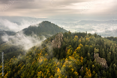 Misty mountains in Autumn - aerial shot of Sokolik in Rudawy Janowickie mountains, Poland.