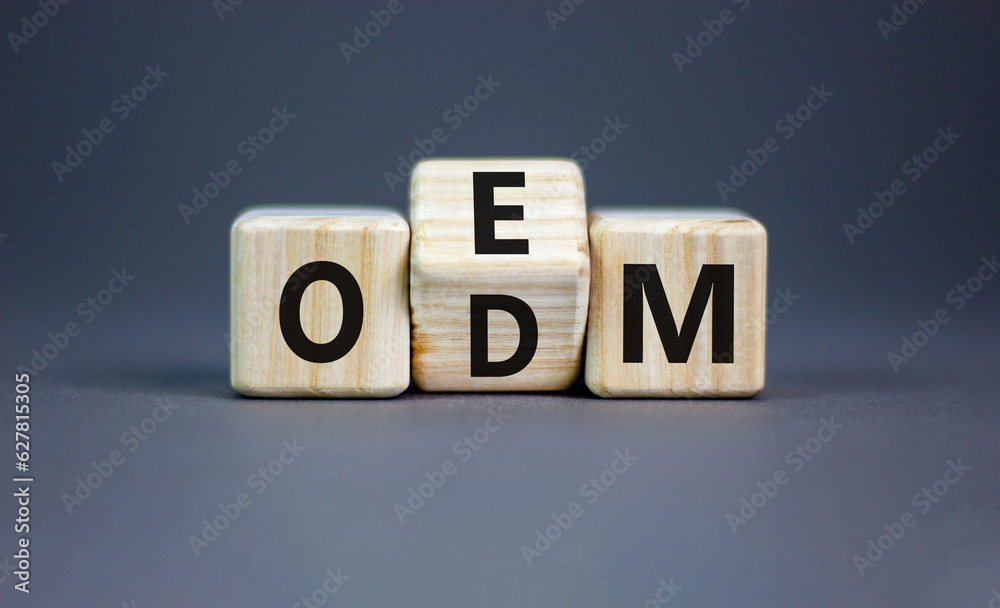 OEM or ODM symbol. Concept word OEM ODM original design equipment manufactirer on wooden block. Beautiful grey table grey background, copy space. Business and OEM ODM concept. OEM or ODM symbol. Concept word OEM ODM original design equipment manufactirer on wooden block. Beautiful grey table grey background, copy space. Business and OEM ODM concept.