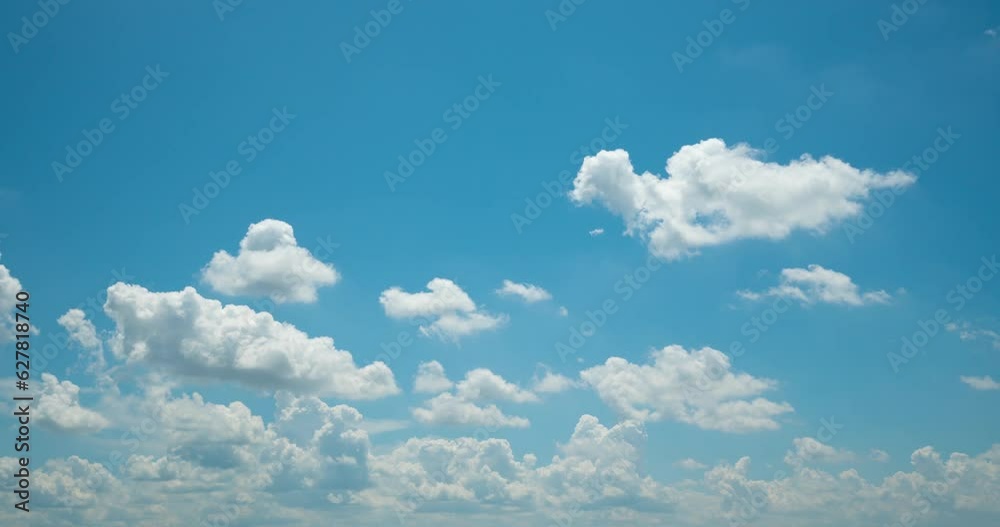 Cloud blue sky background Time lapse Beautiful white clouds approach the point of view backed by a vivid blue sky in this one minute loop Time lapse raw photo interval at 1 second fade at video's end