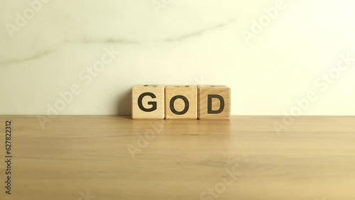 Word God made from wooden blocks. Spirituality, hope concepts