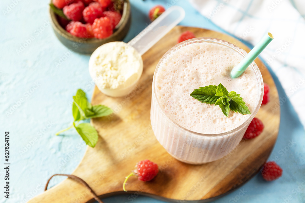 Fresh milk, raspberries drink on wooden board on a stone background, protein shake with fresh berries. Fresh milk, raspberries drink on wooden board on a stone background, protein shake with fresh berries.