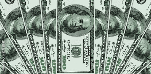 One hundred US dollar bills spread out like a fan