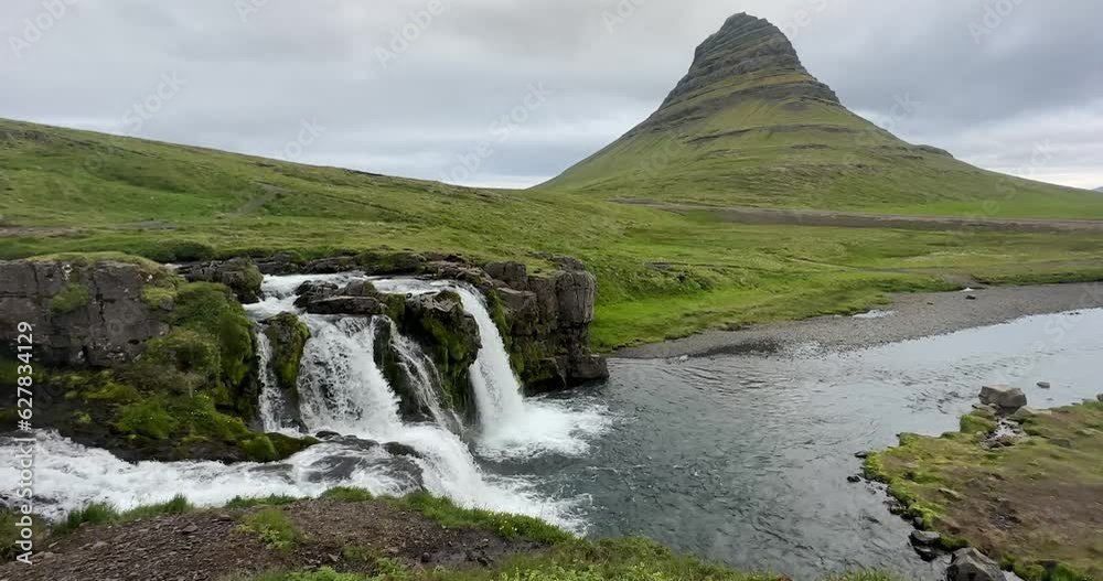 Kirkjufellsfoss waterfall and mountain, in Iceland on the Snaefellsnes Peninsula Kirkjufellsfoss waterfall and mountain, in Iceland on the Snaefellsnes Peninsula