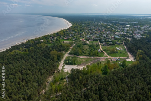 Top drone view of Jurmala near Baltic sea. Summer landscape. Resort in Latvia. Green forest.